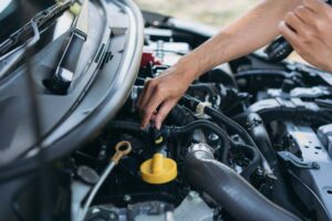 young-man-checking-and-maintenance-on-his-car-car-Q6GA6P2.jpg